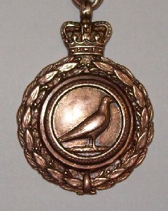 This is an image of the front of a medal awarded to T.Featherstone for for OBA (Old Bird Average) in Palterton 1925. He had won the Young Bird Average a few years earlier