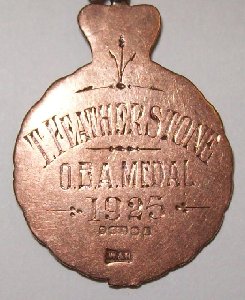 This image is the back of medal pictured above awarded to T.Featherstone for for OBA (Old Bird Average) 
in Palterton 1925.